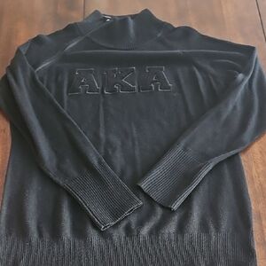 All black AKA zipper sweater from Ivy Box